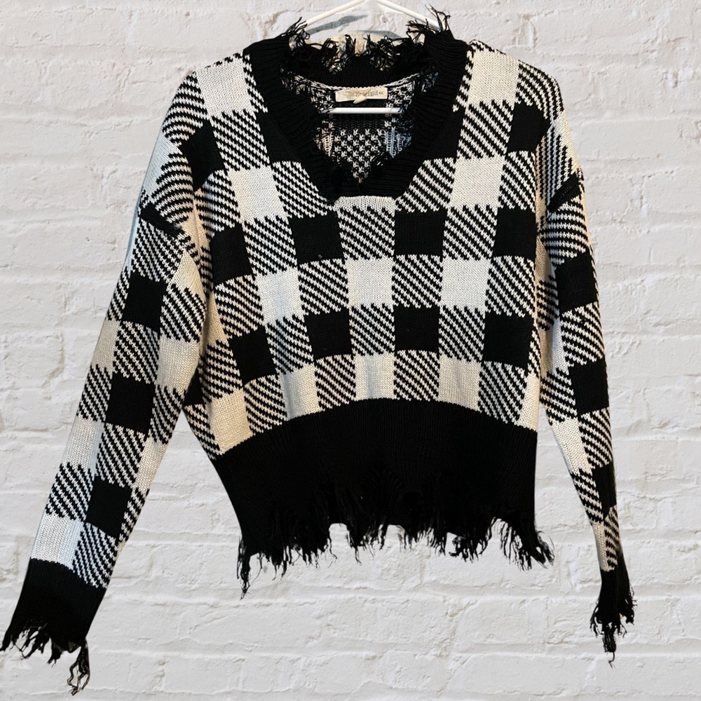 Distressed edge checkered sweater